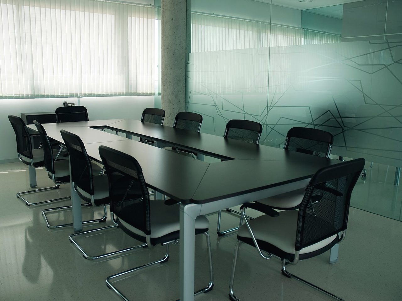 Senior advisor in conversation across a warm walnut desk